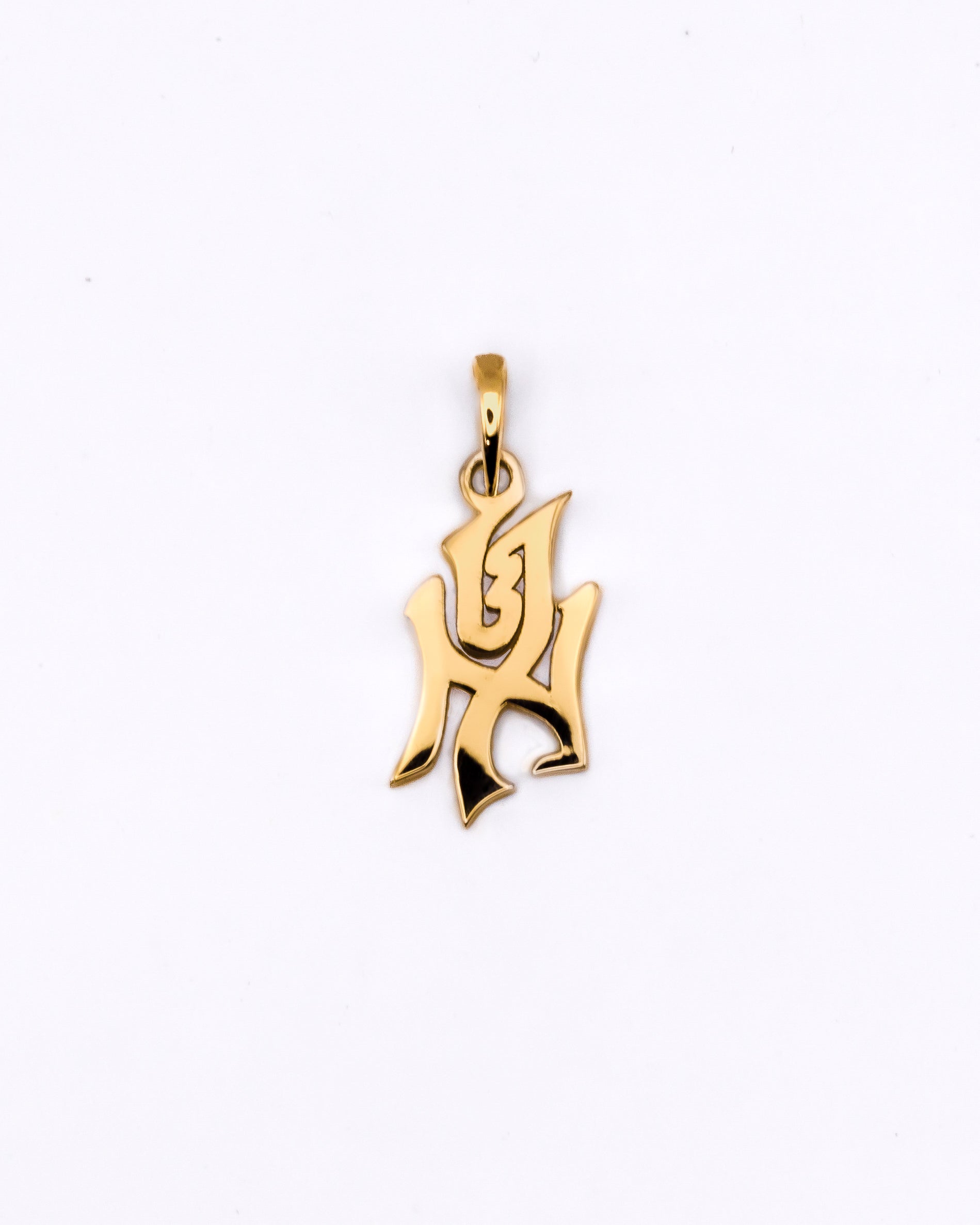 Gold pendant on a white background