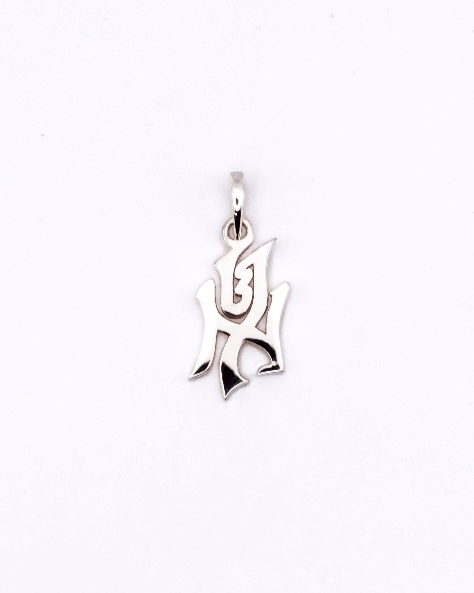 Silver pendant on a white background