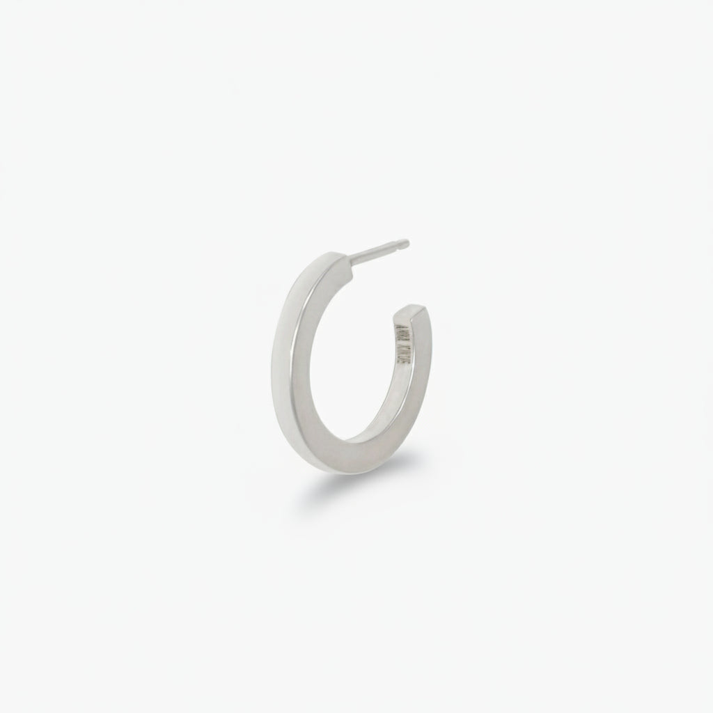 A single rectangular sterling silver hoop earring against a white background.